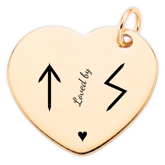 Loved By gold heart pendant engraving close-up: Teiwaz and Sowilo runes, angled Loved by lettering and heart